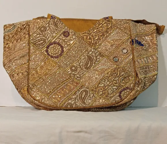 Bolsa indiana de luxo dourada 
