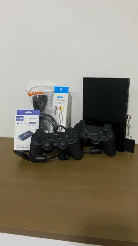 PlayStation 2 seminovo com 2 controles e 30 jogos