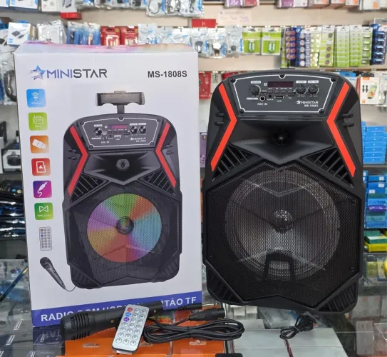 Caixa de som grande com microfone e controle remoto