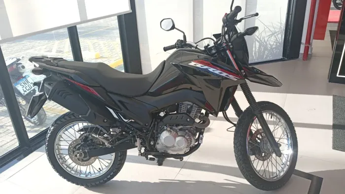 Vendo ou troco num moto de menor valor. *