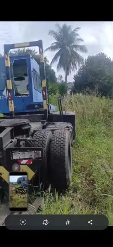 Caminhão guincho para contener