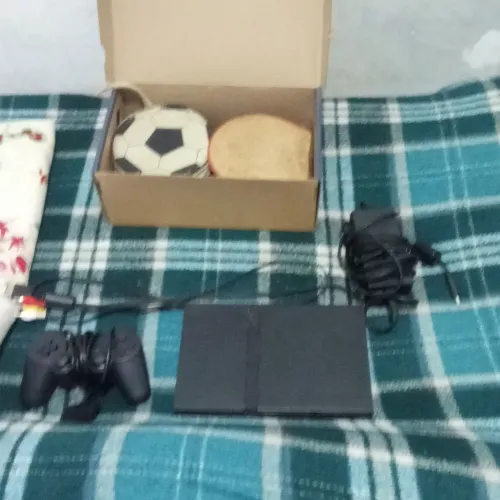 Playstation 2 + Caixas de jogos