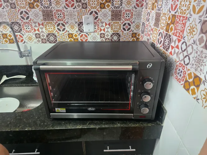 Forno elétrico oster 45 litros 350 reais