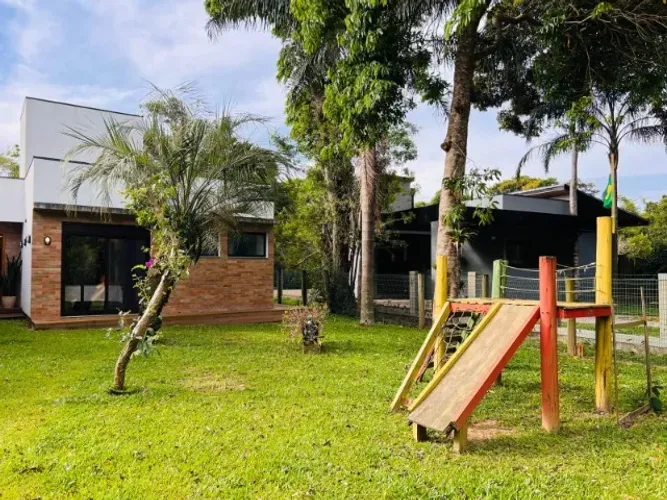 Casa 3 suítes frente lagoa ibiraquera- Praia do Rosa, próximo ao lua marinha-Aluguel anual