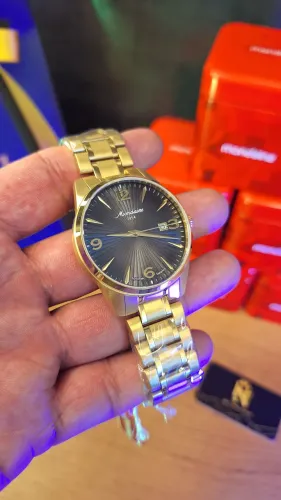 RELÓGIO MONDAINE AUTOMÁTICO DOURADO EDIÇÃO ESPECIAL 70 ANOS 40MM 32851GPMVDA1
