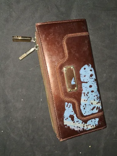 Bolsinha de mão de couro marrom