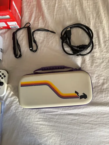 Nintendo oled semi novo + 2 jogos