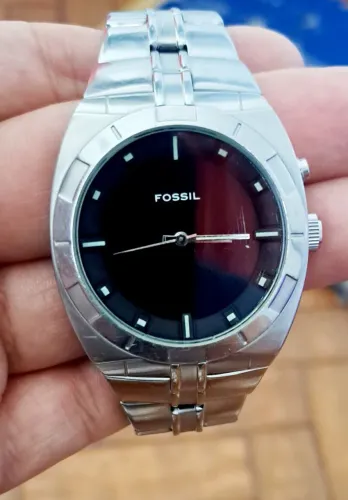 Relógio fóssil para conserto ou aproveitar peças.