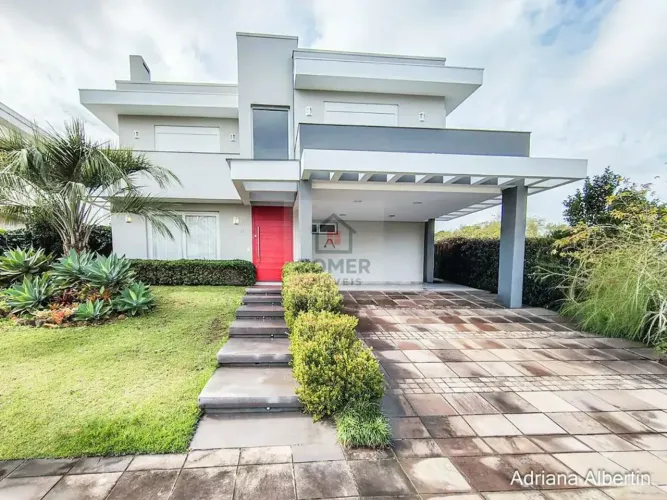 ALPHAVILLE PORTO ALEGRE | CASA COM FUNDOS PARA APP E ÁREA EXTERNA COMPLETA