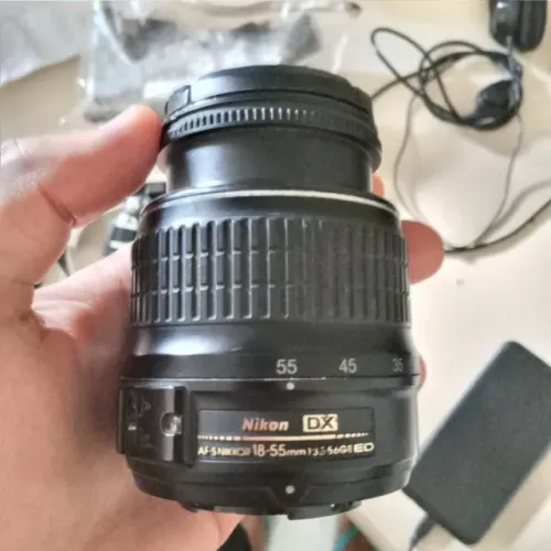 Lente Nikon 18-55mm (quebrada, para retirada de peças)
