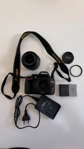 Nikon D5200 + Lente 18-55mm + Lente 50mm f/1.8G + Speed Light + Case