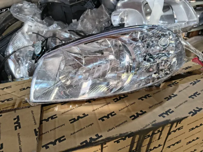 Farol esquerdo Palio cara de rato cromado 08/12 NOVO 