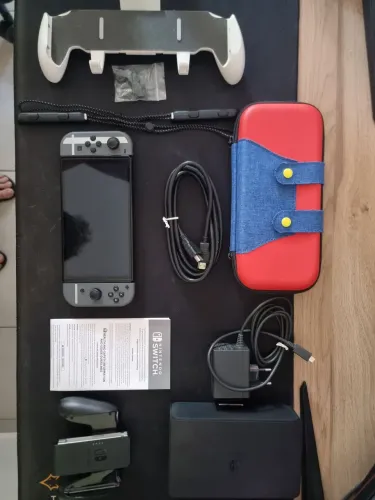 Switch Oled Versao Super Smash Bros Ultimate + Case Mario + Grip e Cover Direcionais