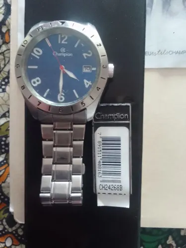 Vendo esse relógio funciona muito bem inteirinho marca Champion original aço e prata 