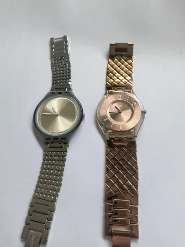 Dois relógios Swatch slim parados