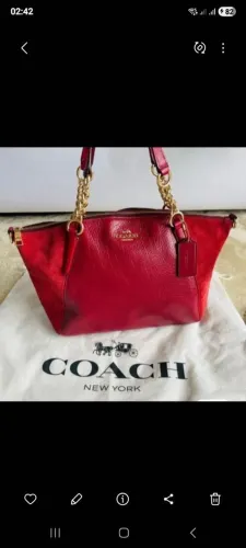 Bolsa coach original vermelha, com couro cru na lateral acompanha best beg e alça removive