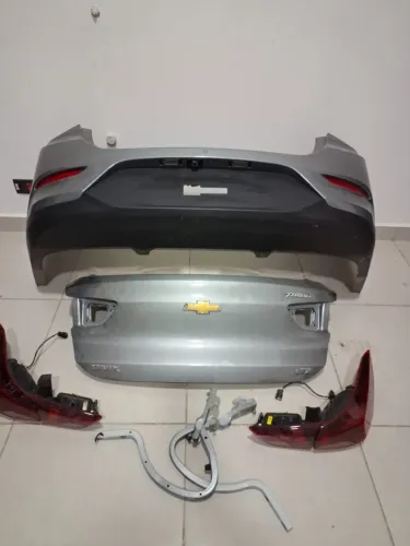 parachoque tampa lanternas onix sedan LTZ 2024