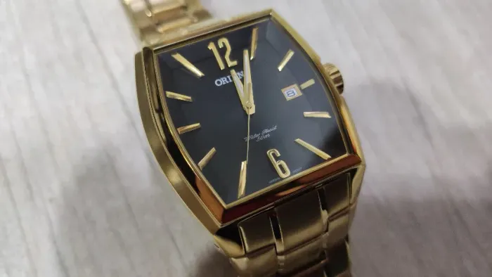 Relógio Orient Japan Original GGSS1014 dourado c/ fundo preto