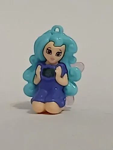 Brinquedo Kinder Ovo fadinha ajoelhada roxa
