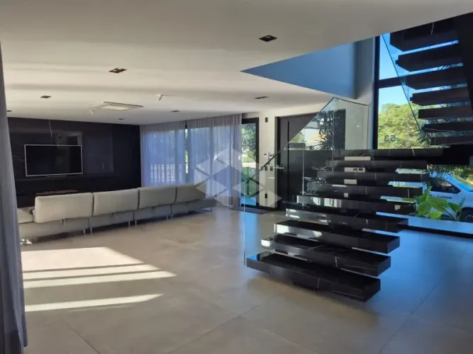 Casa de 5 suítes de alto padrão para alugar no Amoraeville - Jurerê Internacional