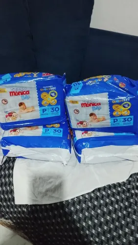 Quatro pacotes de fralda da turma da Mônica p