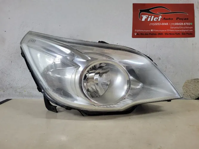 Farol dianteiro Chevrolet Agile 2009 a 2013