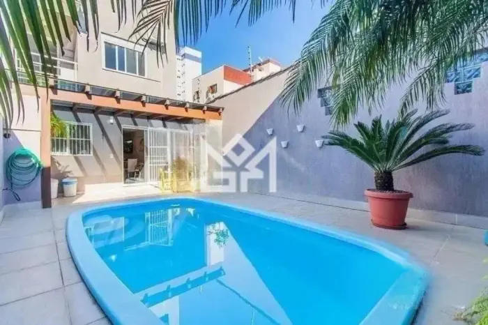 Casa residencial 3 dormitórios (2 suítes) com piscina em Jardim Itu, POA Financiamento di