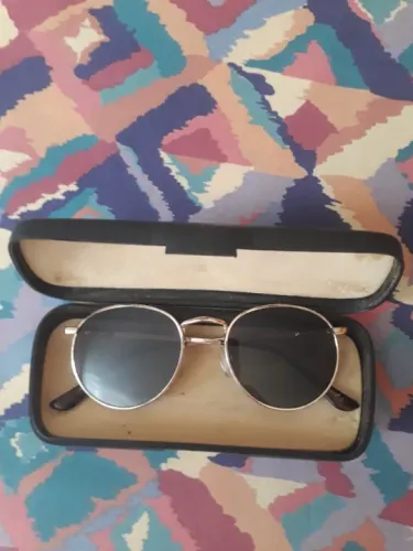 óculos rayban em formato oval