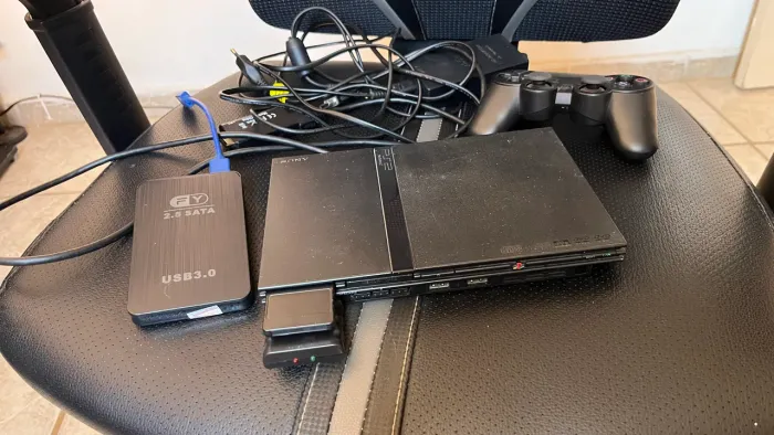 PlayStation 2 com leitor de disco funcionando