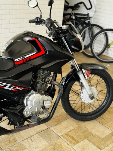 Moto linda + 1 iPhone na caixa