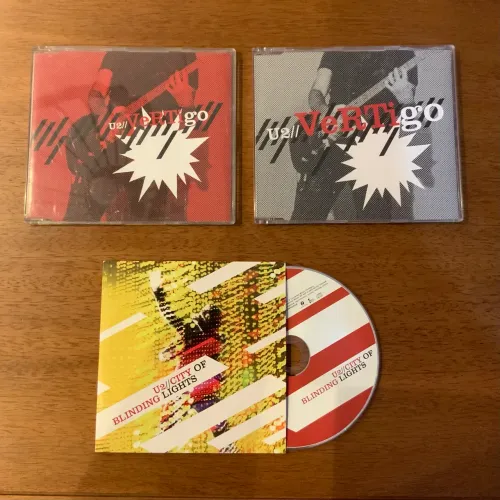 U2 - Singles (VERTIGO - CITY OF BLINDING LIGHTS)
