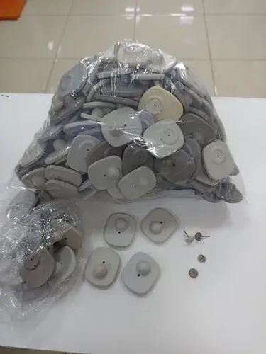Alarme Tag cinza com pino para sistema antifurto para lojas e afins