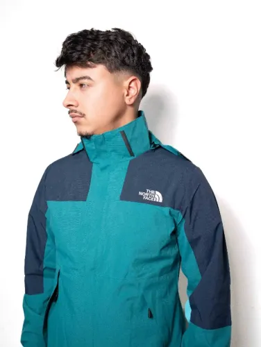 jaqueta corta vento masculina the north face verde petroleo e azul escuro