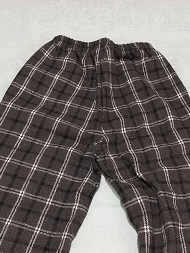 Calça de xadrez tecido felpudo.