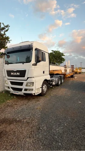 Caminhão traçado man com prancha