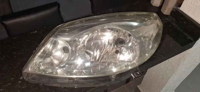 Farol esquerdo original sandero 2012 (foco cromado)