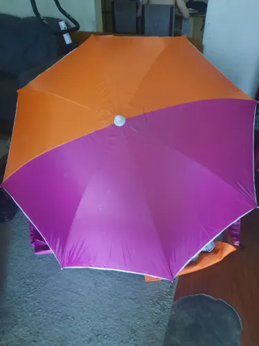 Guarda sol  de praia marca Tribord VDF 59+ 1,60 na cor rosa e laranja