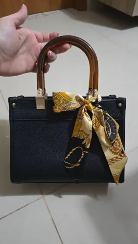 Bolsa de mão com alça longa