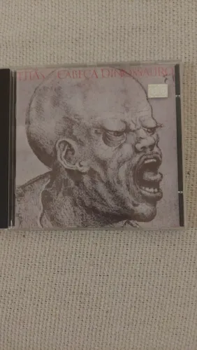 CD TITÃS CABEÇA DINOSSAURO 