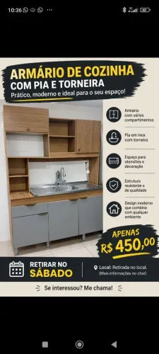 Armário de cozinha com pia e torneira.