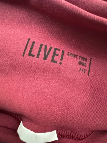 Calça flare LIVE! Com abertura na barra