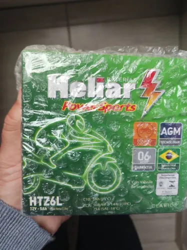 Bateria de moto heliar 5 amperes nova na caixa sem uso.