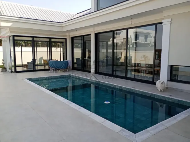 Casa em Condomínio - Condomínio Reserva do Paratehy - 4 Dormitórios - 422m².