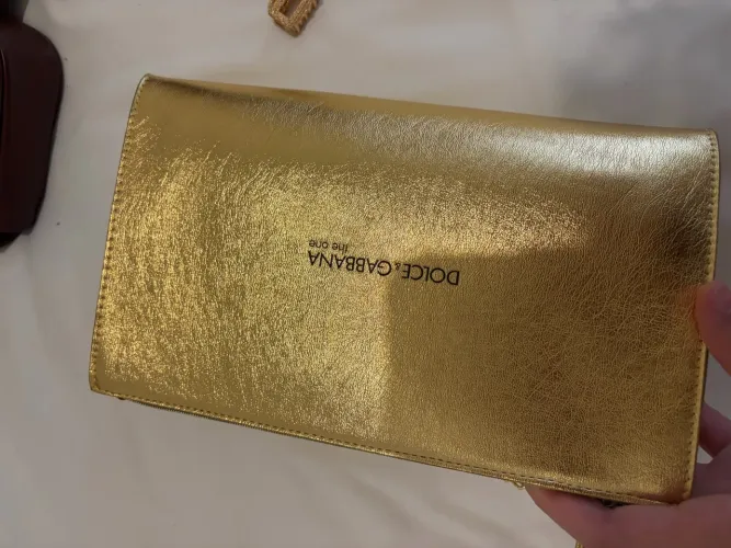 bolsa clutch dolce gabbana the one dourada