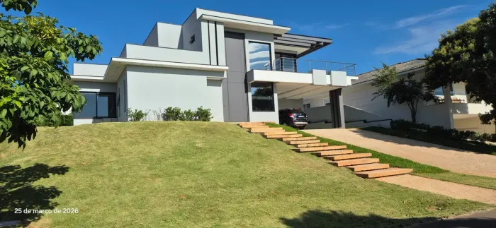 CASA COM ARQUITETURA CONTEMPORÂNEA E PROJETO INTEGRADO, com 4 suítes condomínio FAZENDA SE