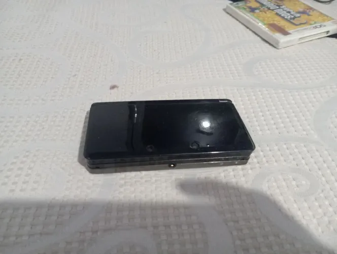 Nintendo 3DS com dois jogos originais o carregador e original mas está com defeito 
