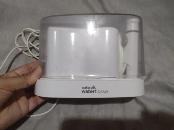 irrigador oral, especificamente o modelo Waterpik Classic Professional Water