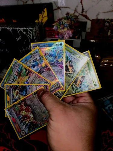 Lote ex regular pokemon eeveelutions evoluções Prismaticas em português