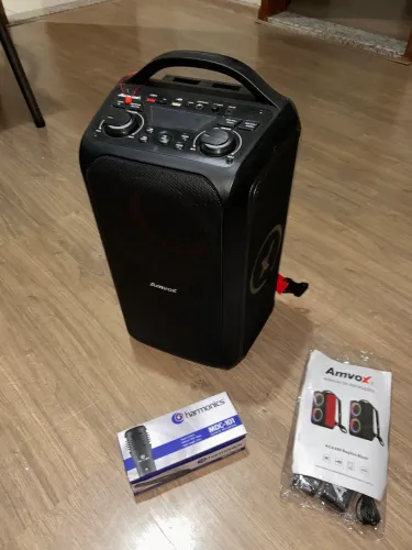 Caixa de Som Amvox 600 com microfone e alça