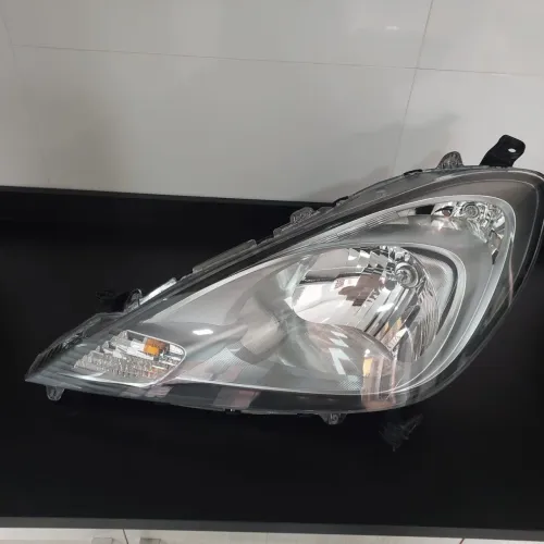 Farol New Fit lado esquerdo